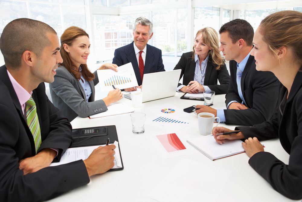 Business meeting at desk - Medium Business