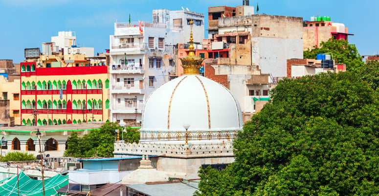 Ajmer Sharif Dargah white marble dome and courtyard with surrounding buildings in Ajmer